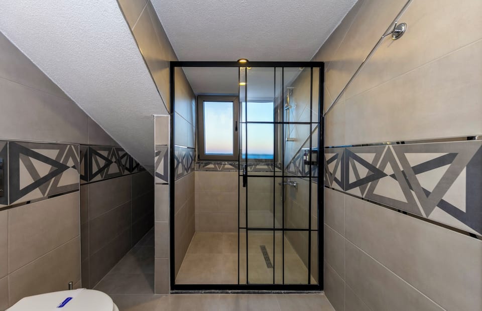 Connected Family Rooms | Bathroom | Slippers, towels