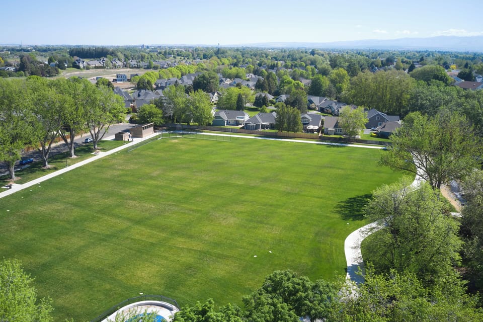 Large open green spaces nearby make walks and outdoor time easy to enjoy.