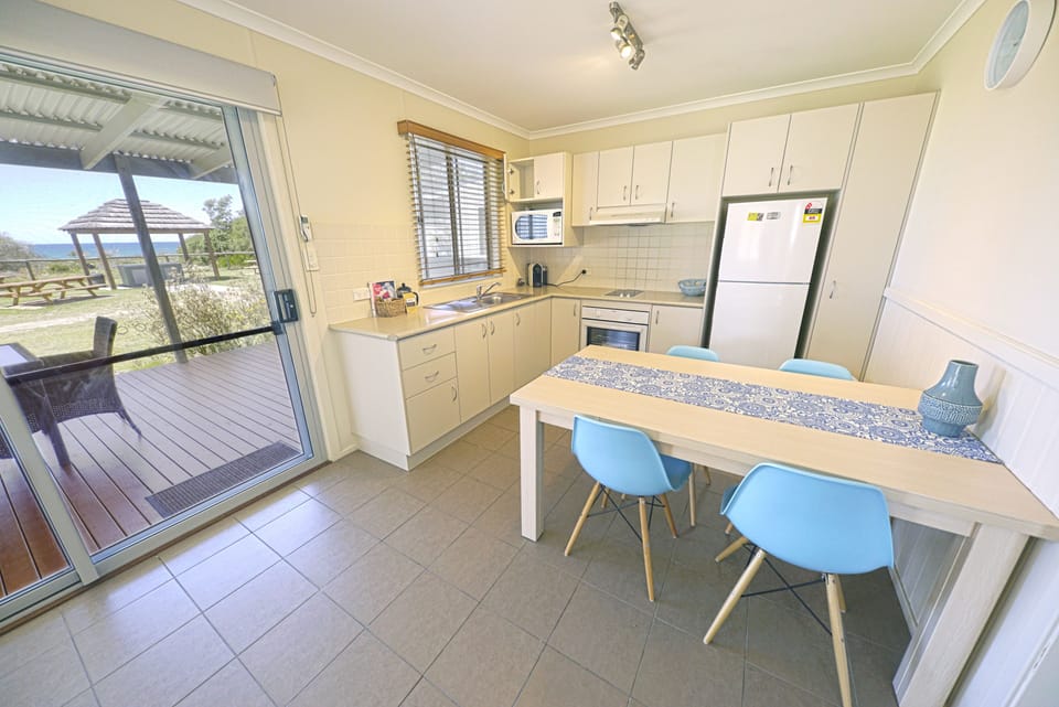 Surf Villa, 2 Bedrooms, Non Smoking, Kitchen (Surf Villa - 4 star) | Private kitchen | Full-size fridge, microwave, coffee/tea maker, electric kettle