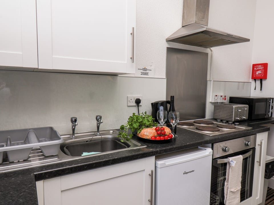 Fridge, electric kettle, toaster, cookware/dishes/utensils