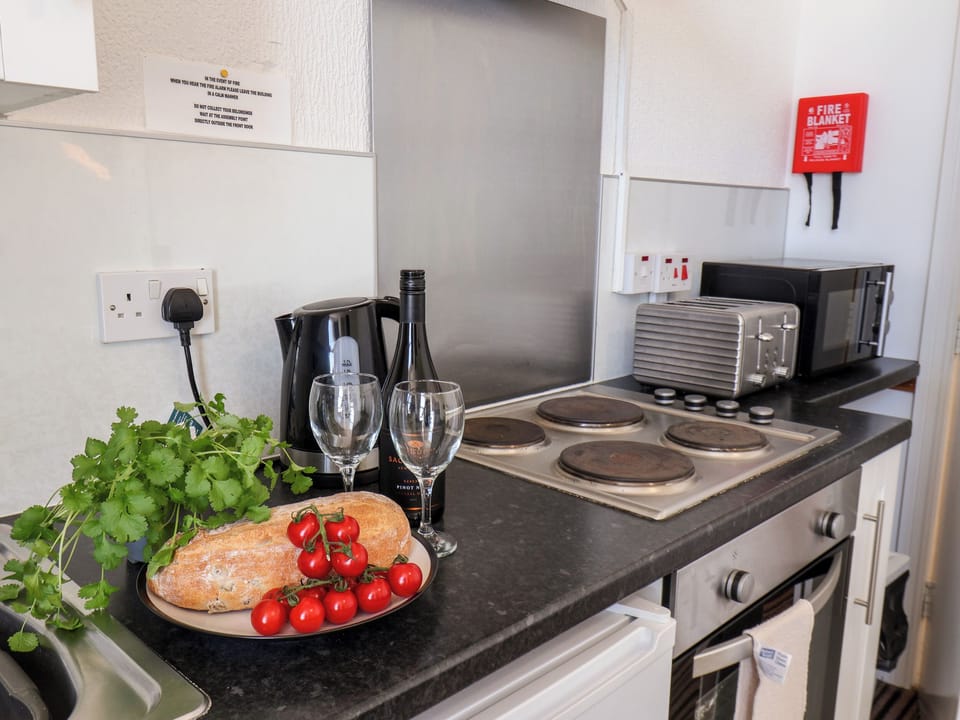 Fridge, electric kettle, toaster, cookware/dishes/utensils