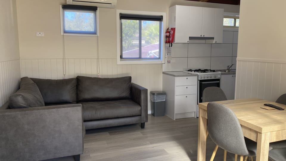 Standard Double Room | Living area | 24-inch flat-screen TV with digital channels, TV