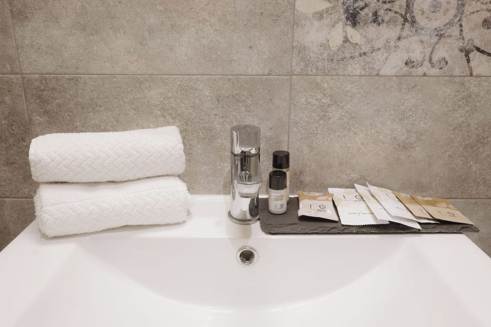 Classic Suite | Bathroom | Hair dryer, bathrobes, slippers, towels