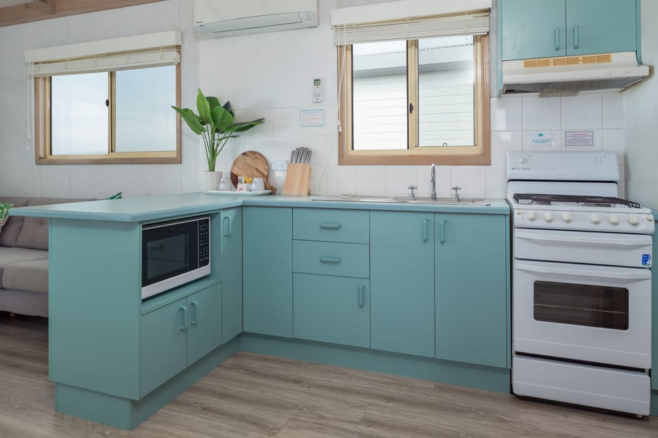 Beachfront Holiday Cabin (1 Queen, 1 Bunk and 1 Single Bed) | Private kitchen | Coffee/tea maker, fridge, microwave, stovetop