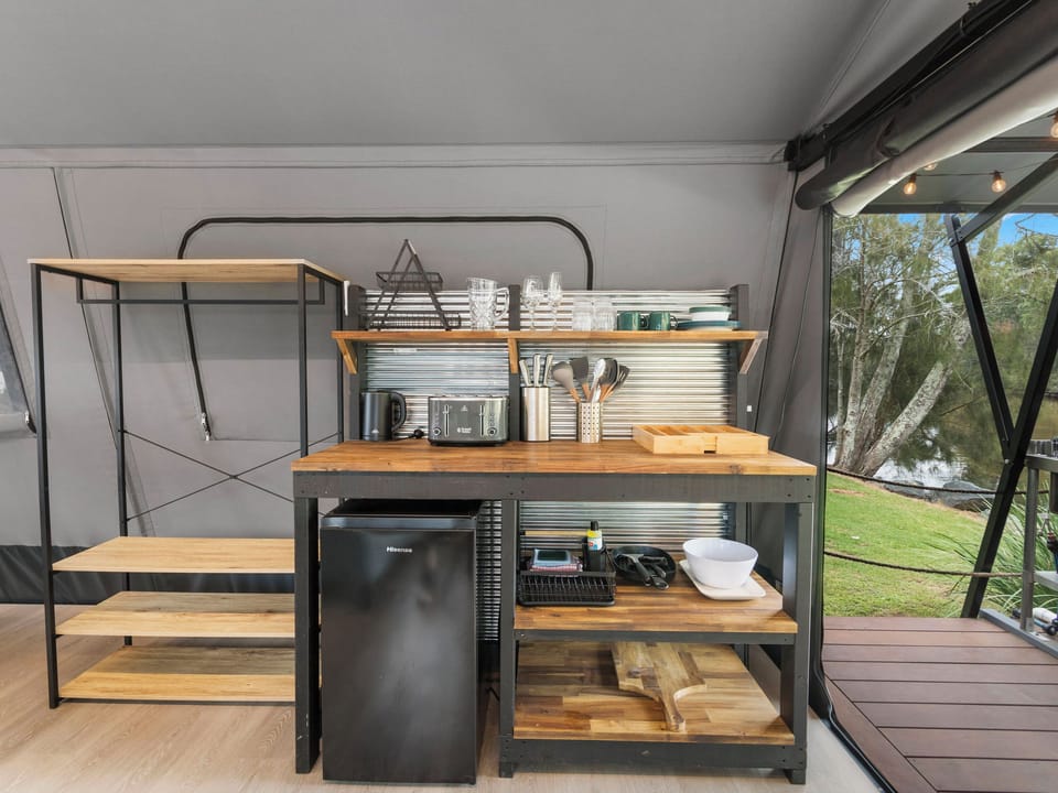 Deluxe Creekfront Safari Tent  No Ensuite | Private kitchen | Shared microwave, toaster, cookware/dishes/utensils, dining table
