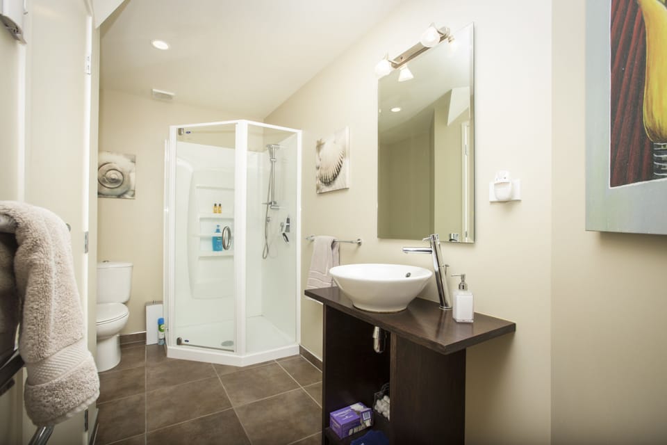 Suite, 1 Bedroom (Matakana) | Bathroom | Free toiletries, hair dryer, heated floors (bathroom), towels