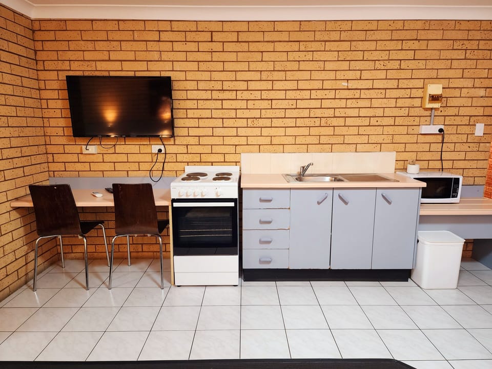 Large Family Room with Balcony (Non Pet Friendly) | Private kitchen | Fridge, microwave, stovetop, coffee/tea maker