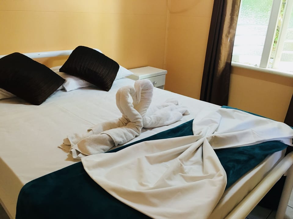 Standard Room, Non Smoking, Shared Bathroom (Double Room with Air Con) | In-room safe, free WiFi, bed sheets