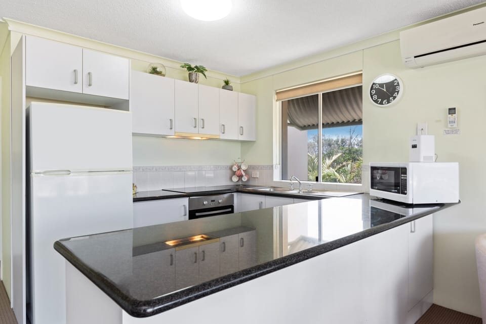 Two Bedroom Apartment With Rooftop Access | Private kitchen | Coffee/tea maker, full-size fridge, microwave, oven