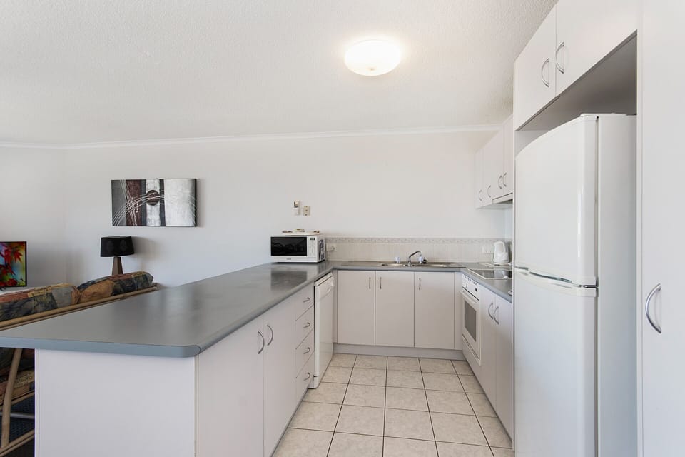 Two Bedroom Apartment With Rooftop Access | Private kitchen | Coffee/tea maker, full-size fridge, microwave, oven
