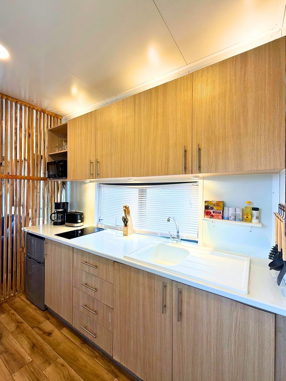 Mini-fridge, microwave, stovetop, coffee/tea maker