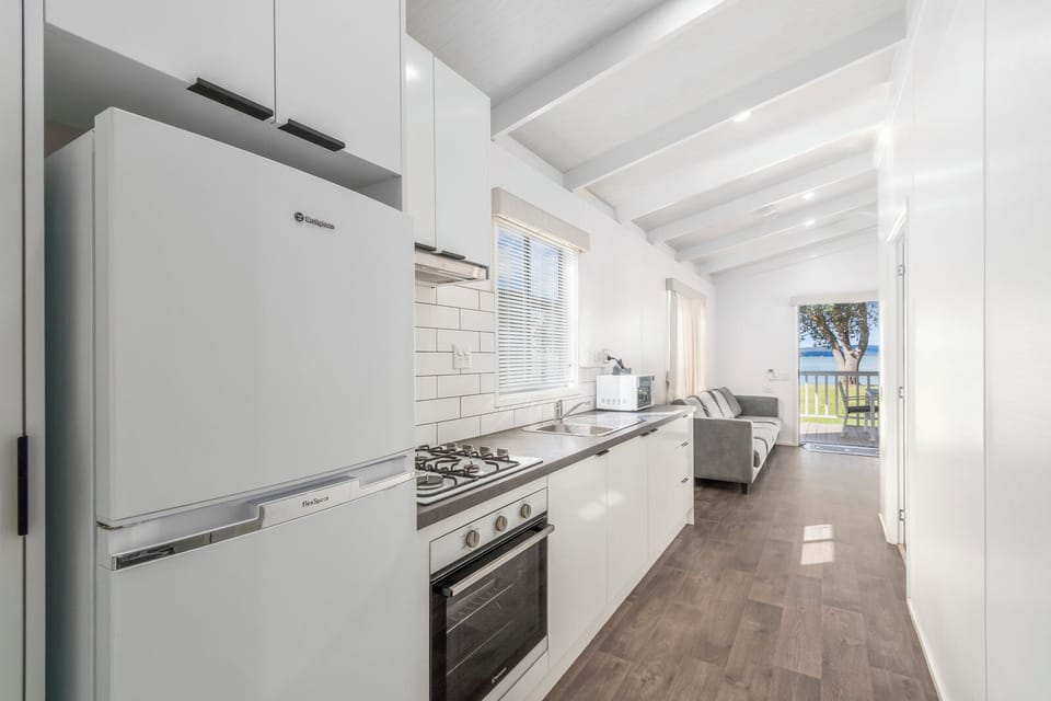 2 Bedroom Accessible Deluxe Beachfront Villa | Private kitchen | Fridge, microwave, oven, stovetop