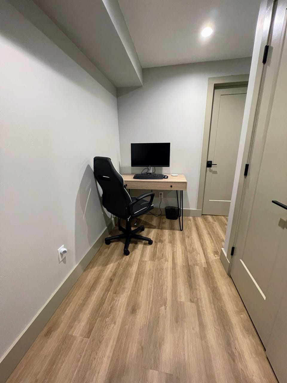 Office area with a new large 4K 27" monitor USB-C, keyboard, mouse, camera