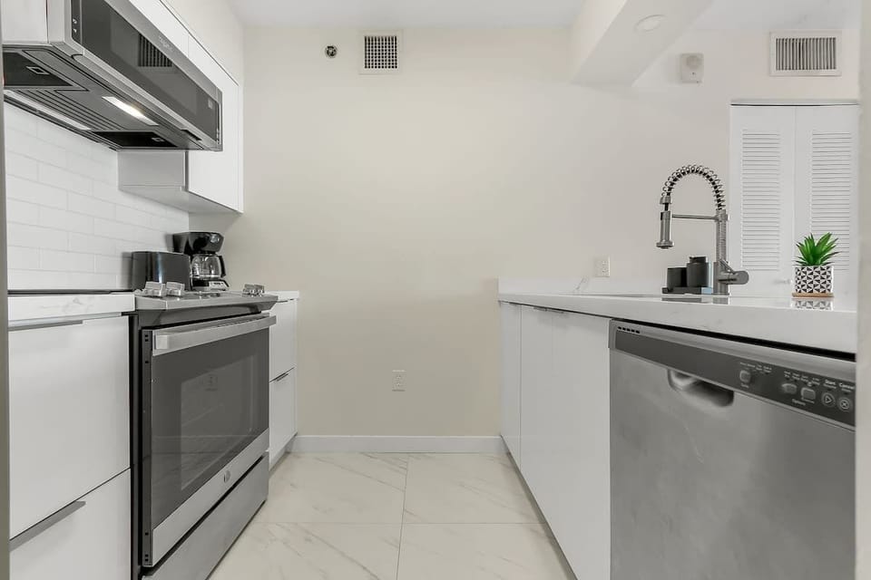 Fully stocked kitchen with complete set of cookware.