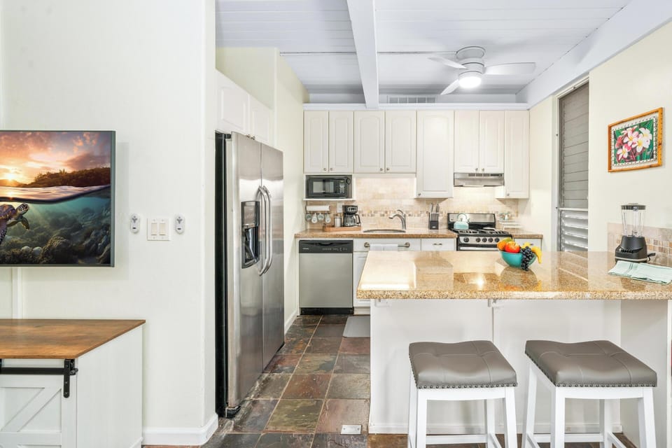 Refrigerator/Freezer with ice and cold water dispenser. Make sure to try some of our Hawaii-made ice cream or Gelato.