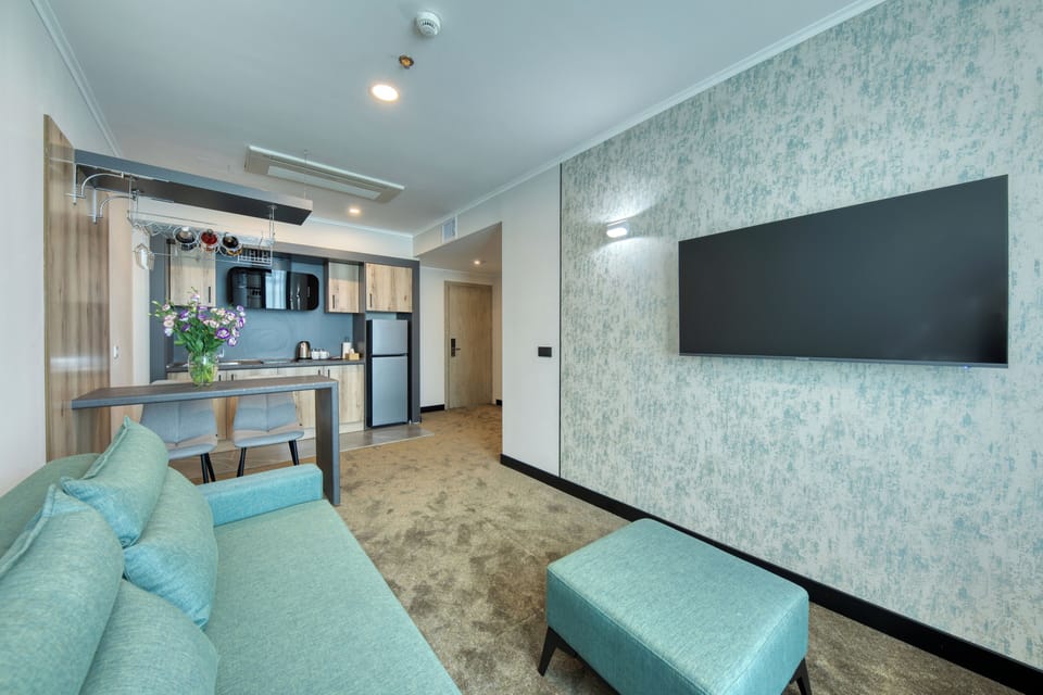 Executive Quadruple Room, 2 Bedrooms, City View | Desk, laptop workspace, bed sheets