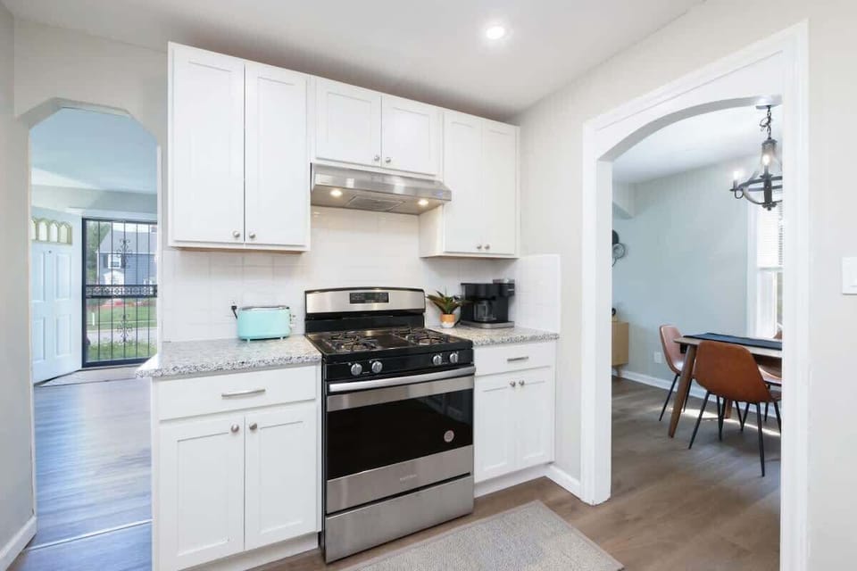 - Fully equipped kitchen with stainless steel gas range and oven   - Granite countertops and white cabinetry provide clean style   - Modern appliances including coffee maker for daily convenience  