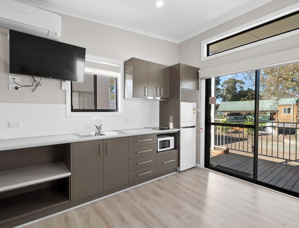Deluxe Studio - Not Pet Friendly | Private kitchen | Microwave, stovetop, toaster, cookware/dishes/utensils
