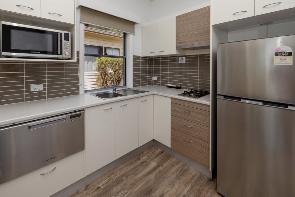 Family Villa | Private kitchen | Coffee/tea maker, full-size fridge, microwave, stovetop