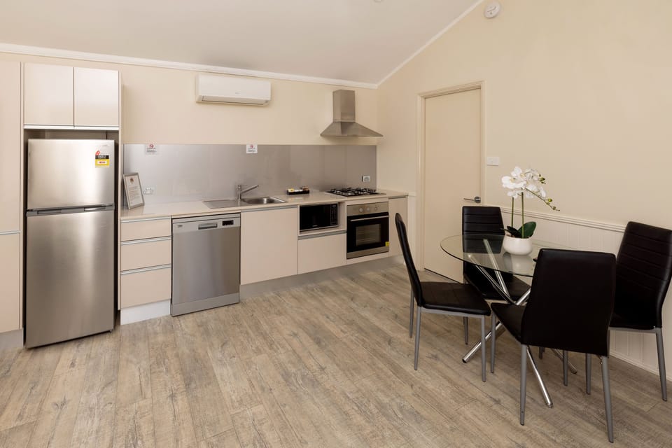 Deluxe Villa | Private kitchen | Coffee/tea maker, full-size fridge, microwave, stovetop