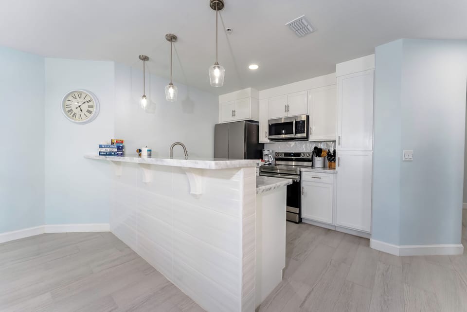 Upgrade your beach getaway w this luxurious vacation condo, where you can relax in an open living area, enjoy a meal at the dining area, and cook in the modern kitchen - with beautiful granite countertops!