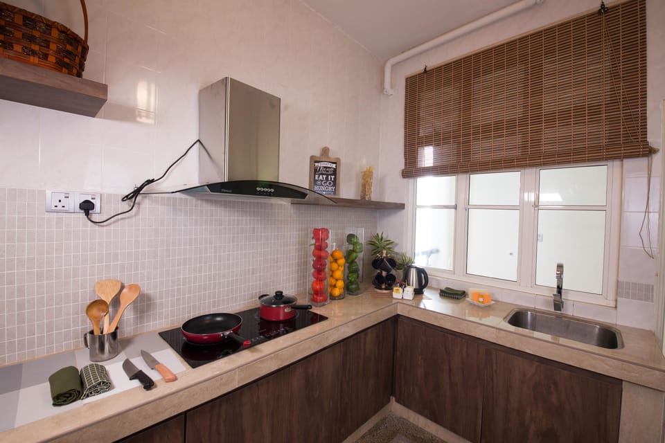 Three Bedroom Deluxe Apartment (Without Kitchen Facilities) | Private kitchen | Full-size fridge, coffee/tea maker, cookware/dishes/utensils