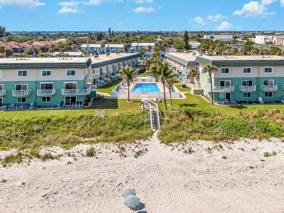unit is in the building to the left on the corner (top 2 floors) direct ocean front