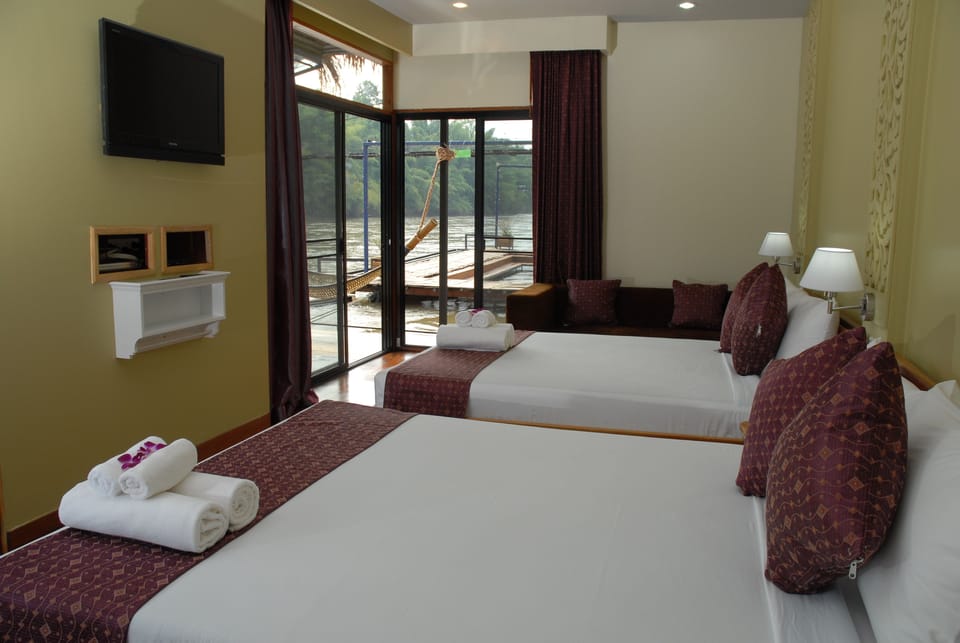 Family Suite | Minibar, in-room safe, blackout drapes, rollaway beds