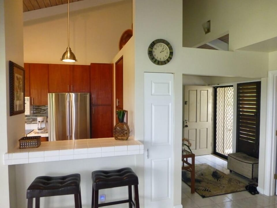 Open Kitchen With Breakfast Bar Adjacent To Dining Area & Lanai