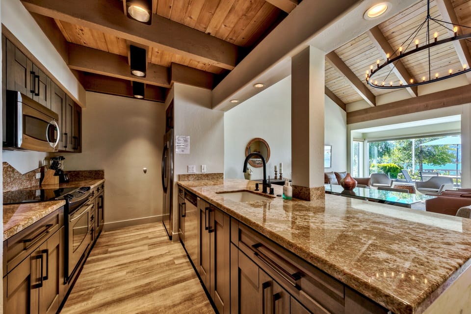 Cook meals on gorgeous granite countertops under stunning exposed beam ceilings, with everything you need for your perfect getaway.
