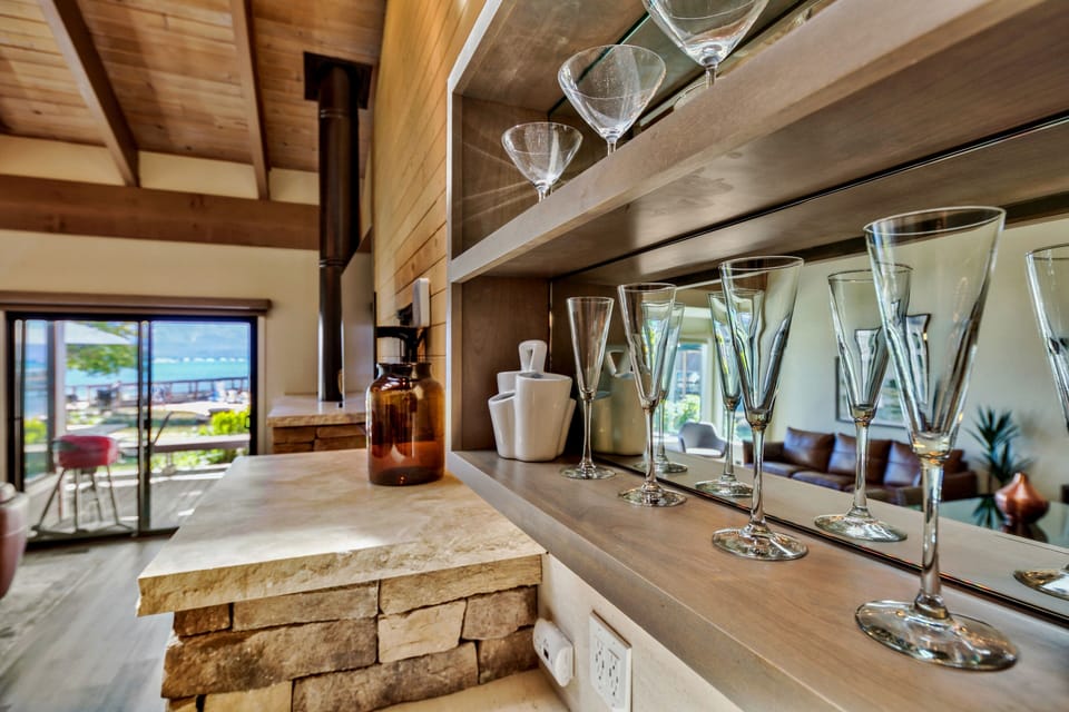 Celebrate special moments in your beautifully appointed kitchen, where elegant glassware awaits your favorite wines and stunning ocean views create the perfect backdrop.