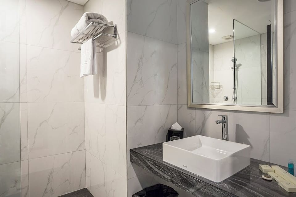 Shower, free toiletries, slippers, towels