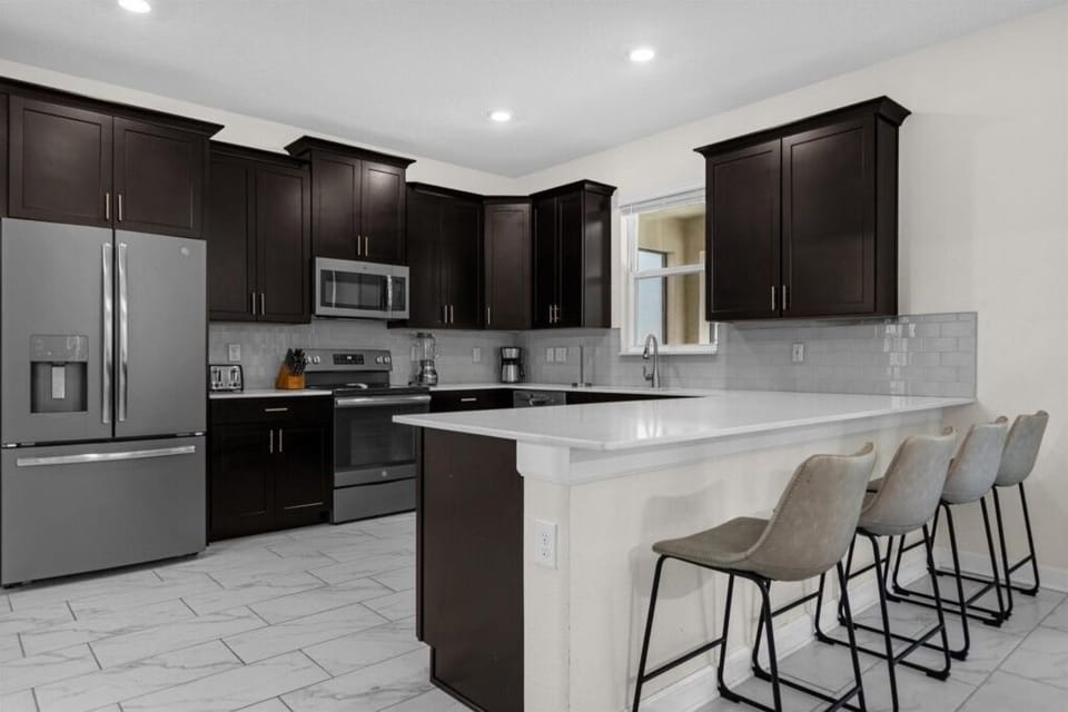 House, Multiple Bedrooms | Private kitchen | Microwave, dishwasher, electric kettle, toaster