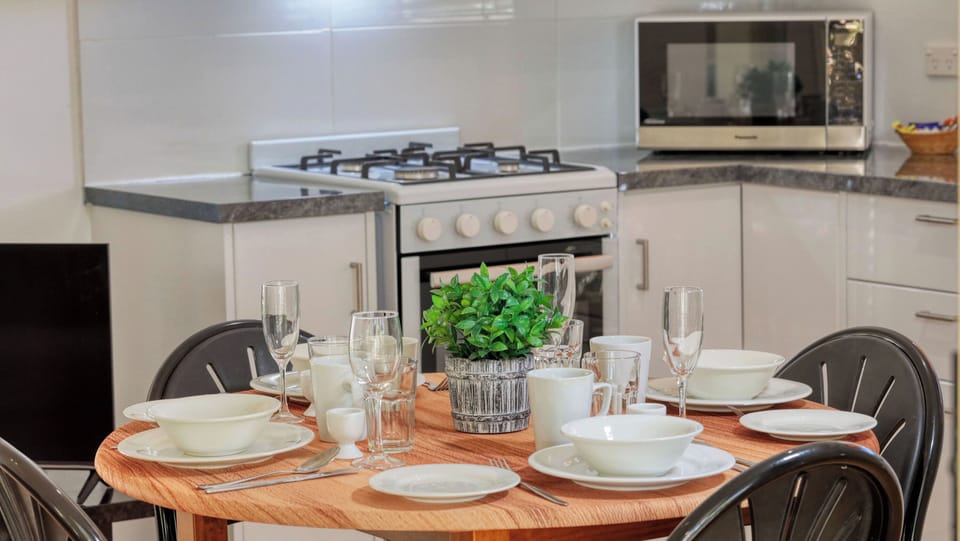 Queen Cabin | Private kitchen | Coffee/tea maker, full-size fridge, microwave, stovetop