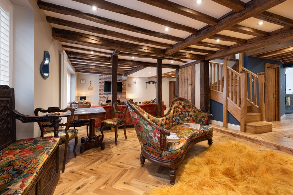 entrance hall with antique bench and chaise.