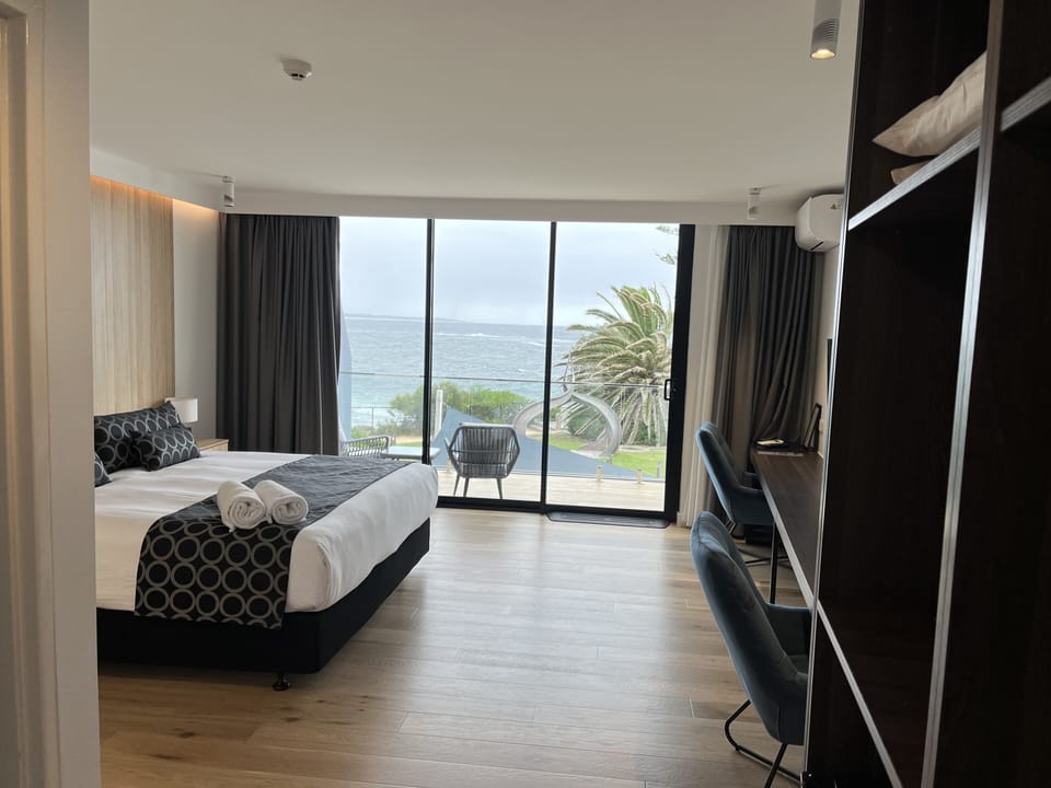 Deluxe Room - First Level Accessible | Living area | Flat-screen TV, Netflix
