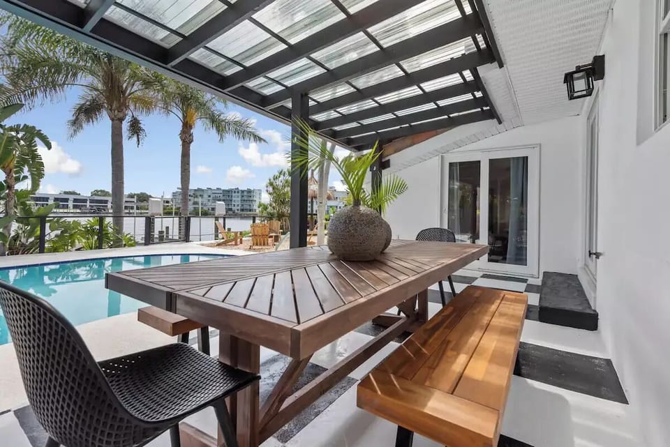 Outside dining space under our expansive pergola