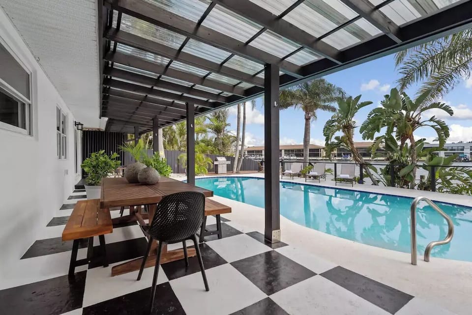 Outside dining space under our expansive pergola