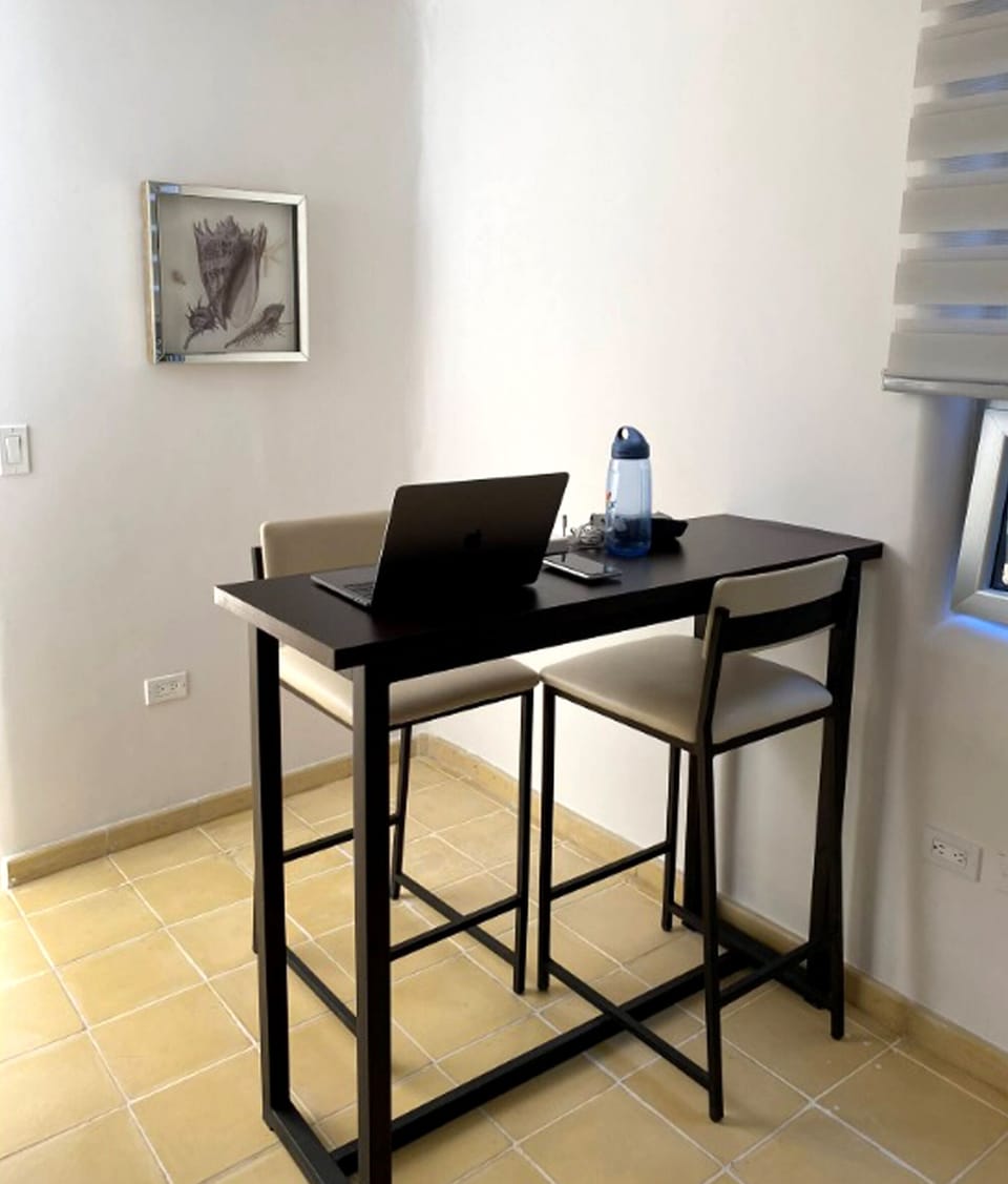 Deluxe Suite | Living area | 40-inch flat-screen TV with digital channels