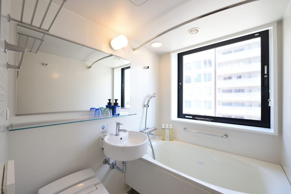 Combined shower/tub, free toiletries, hair dryer, slippers
