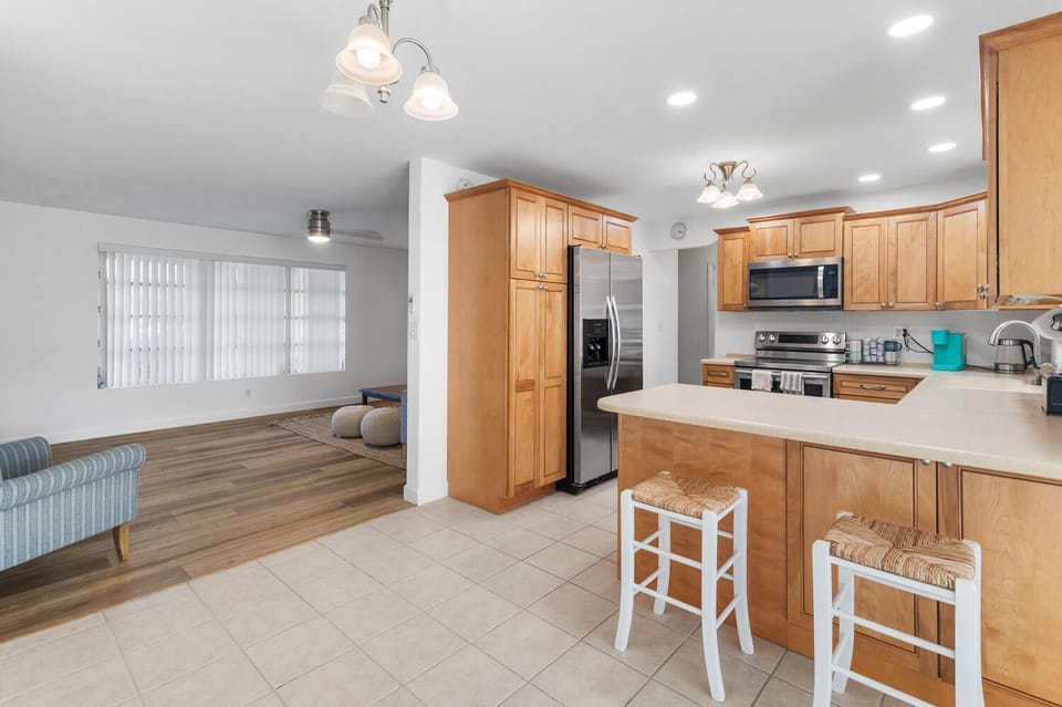 Experience the perfect blend of style and functionality in this modern kitchen! With sleek stainless steel appliances and inviting bar seating at the counter, it’s an ideal space for casual meals and entertaining guests.