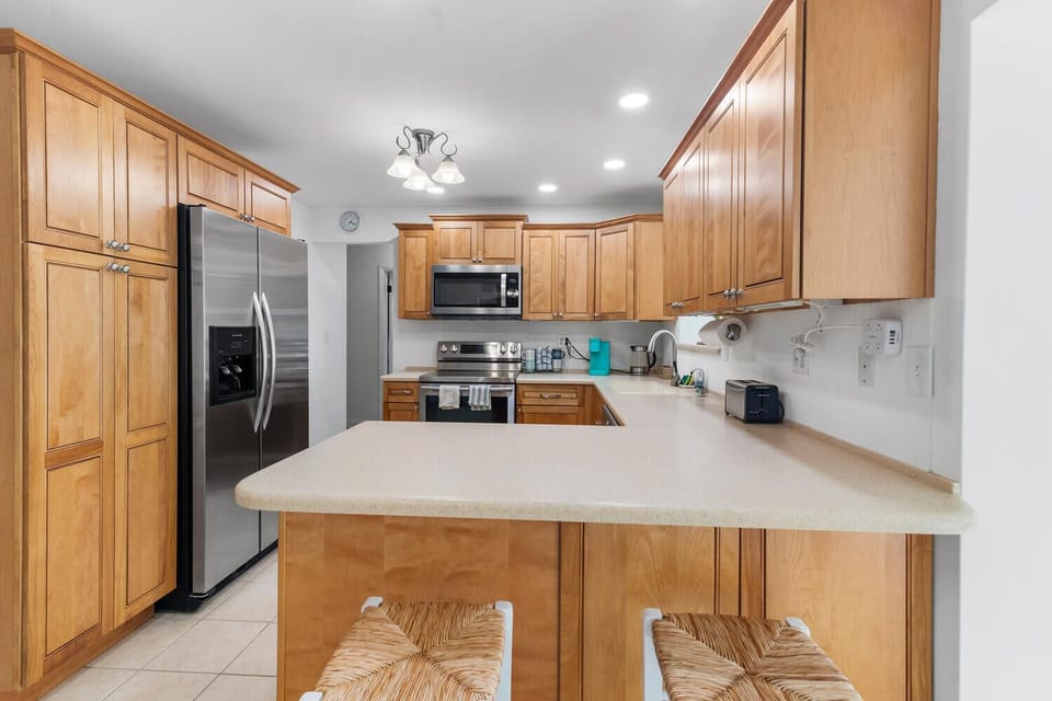 Experience the perfect blend of style and functionality in this modern kitchen! With sleek stainless steel appliances and inviting bar seating at the counter, it’s an ideal space for casual meals and entertaining guests.