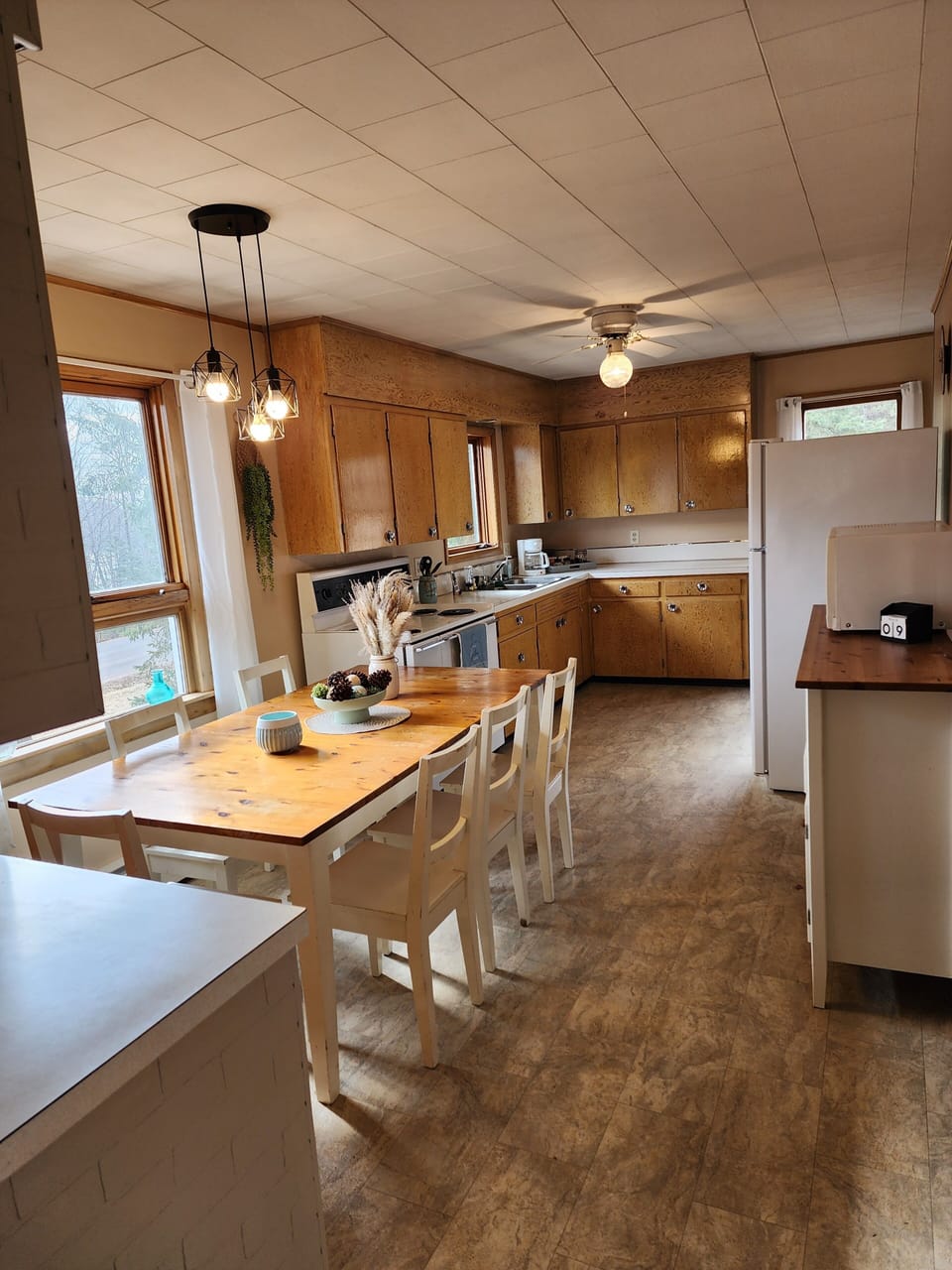 Kitchen & dining with basic amenities provided. 