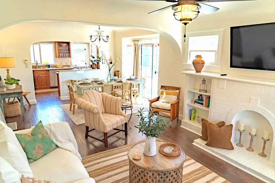 Light and breezy, the living room and dining room flow into the kitchen.