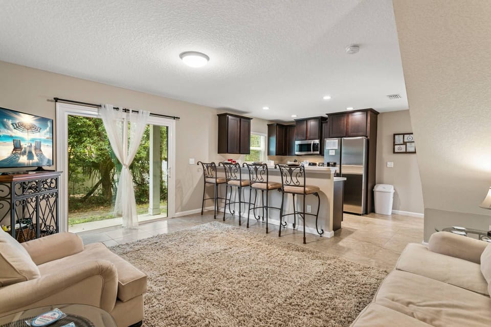 Cozy open living area with sliding doors to the back patio area