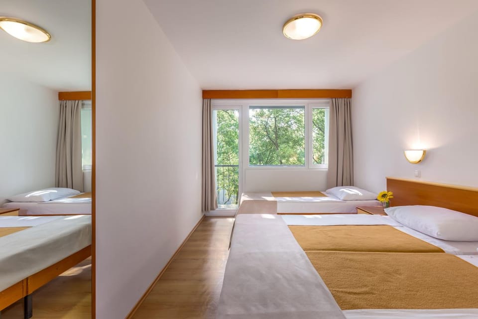 Standard Triple Room, Balcony (Sea Side) | Desk, bed sheets