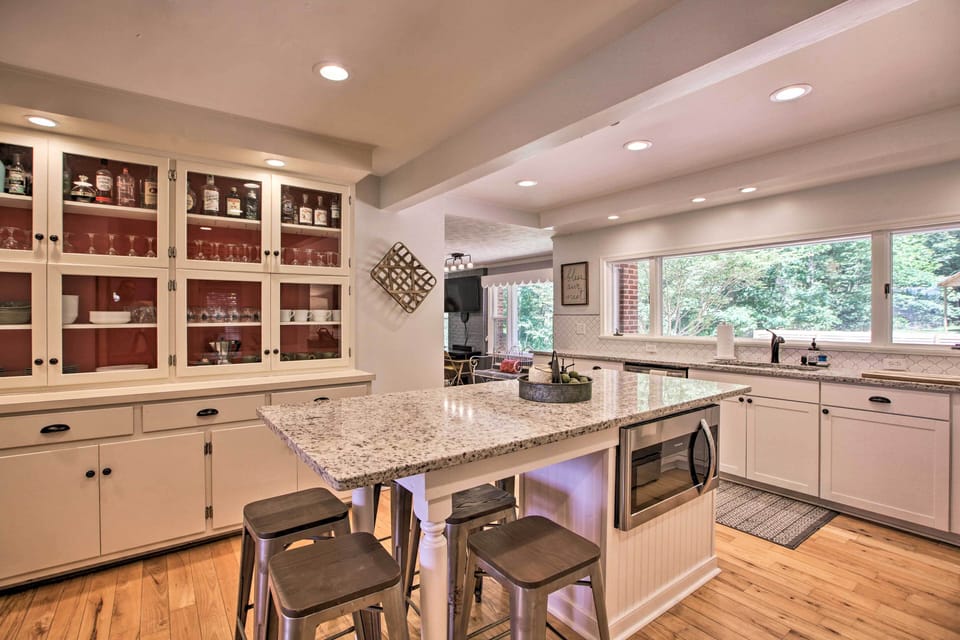 Another view of the spacious kitchen designed for gathering and shared meals