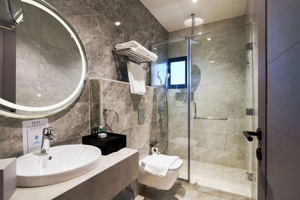 Separate tub and shower, free toiletries, bathrobes, slippers