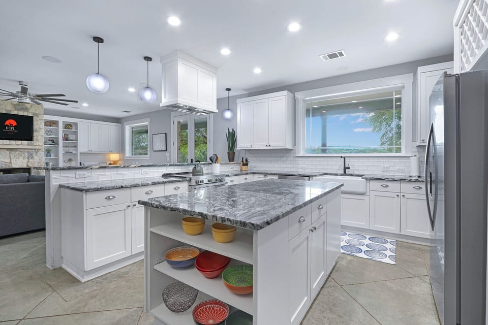The kitchen features a large island perfect for food preparation.