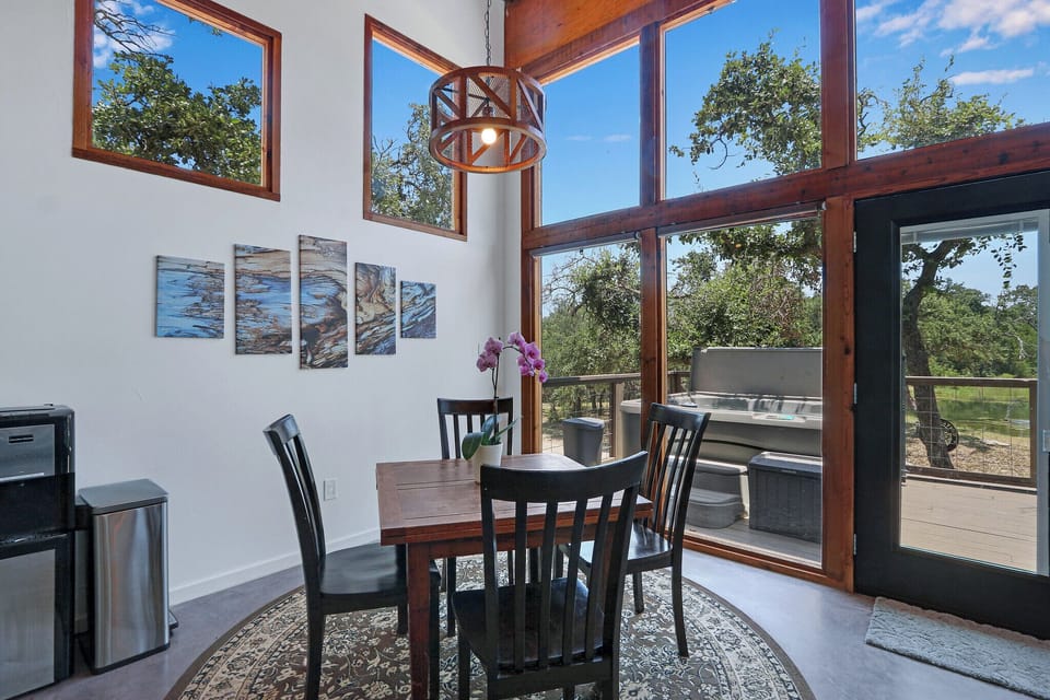 View showing the rear of the entry door and dining area in the cabin.
